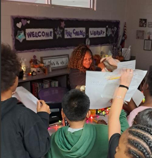 students with librarian